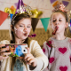 Happy children in party caps