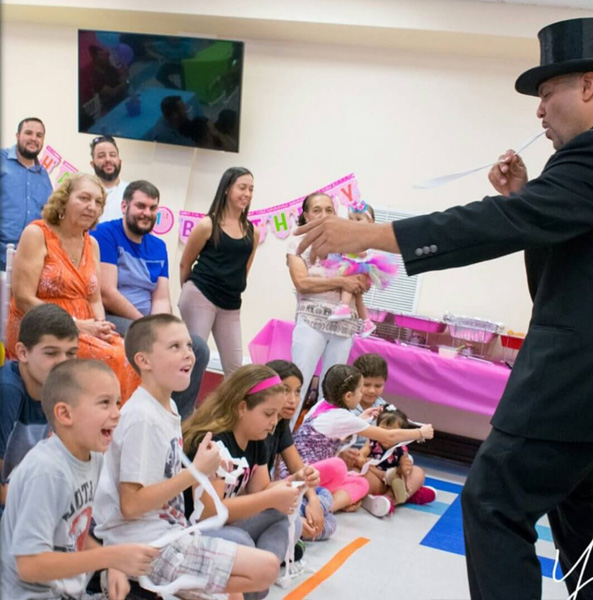 Costumed character entertaining party guests